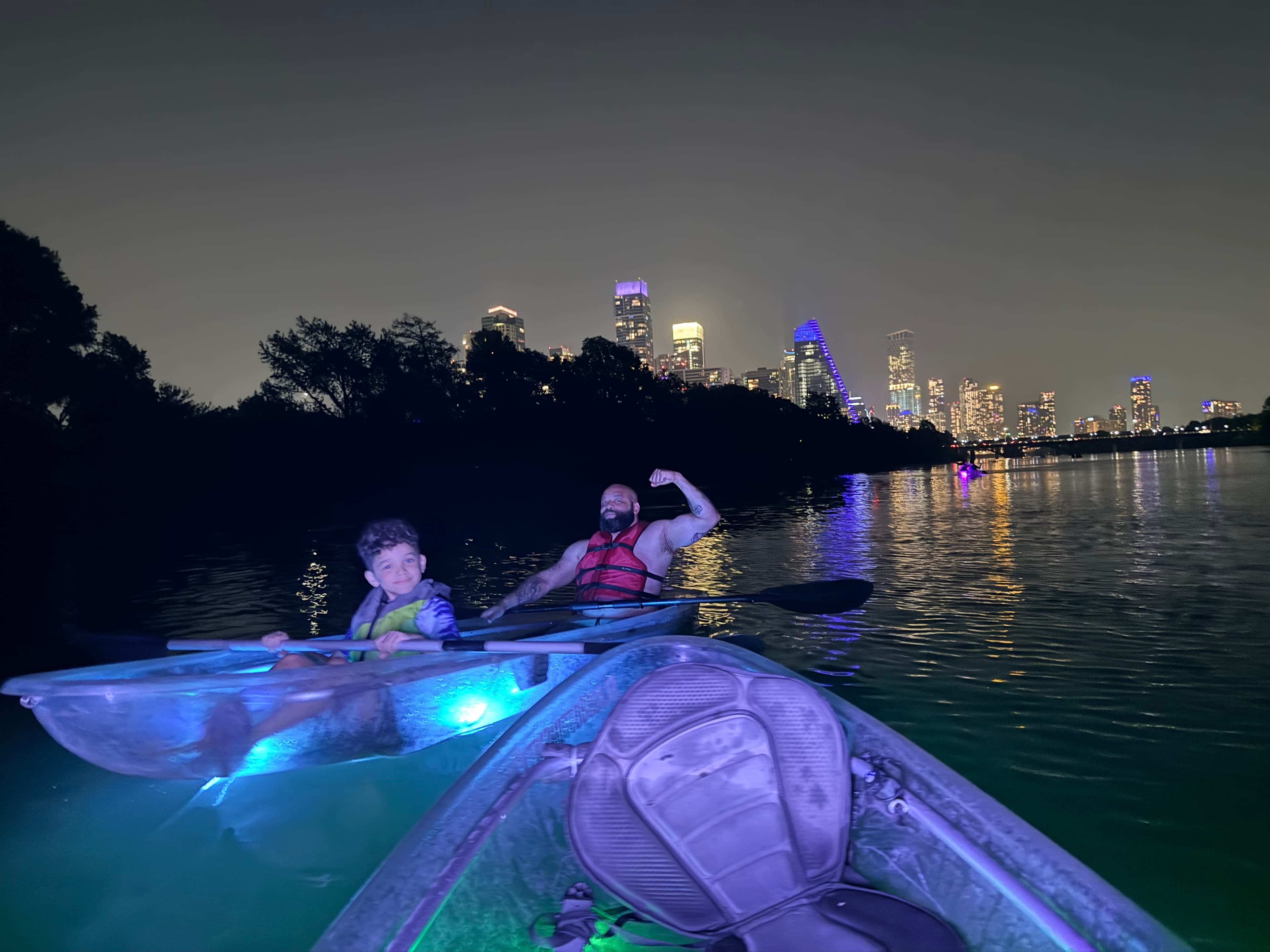 Kayakers watching bats emerge at sunset on Lady Bird Lake
